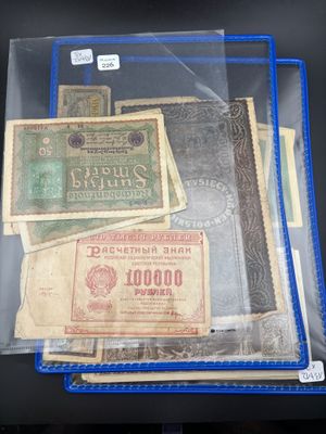 a lot of old paper money in a clear bag