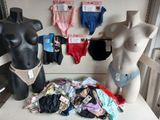 a mannequin with underwear on display next to a display of underwear