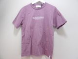 purple t - shirt with white logo on it hanging on a hanger