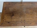 a small wooden table with a drawer underneath it