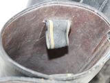 a close up of a pair of shoes with a yellow stripe on them