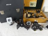 many different types of microscopes in a case