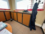a coat rack in the corner of a room