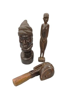 wooden figurines of a man and a woman with a hammer