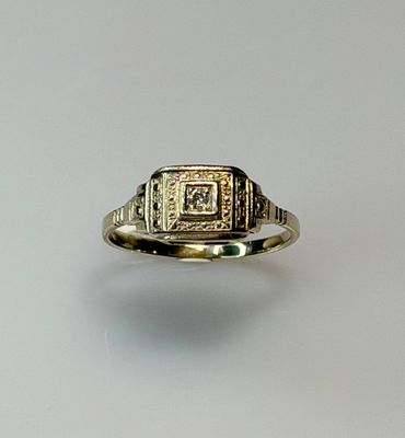 an image of a gold ring with a diamond in the center