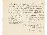 une lettre écrite à l'encre noire sur une feuille de papier