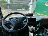 a driver in the driver ' s seat of a bus
