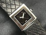 an image of a watch on a black leather strap