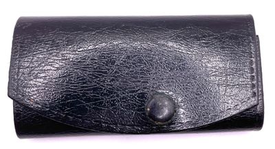 black leather business card case on a white background