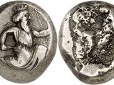 a silver coin with an image of a woman and a man on it