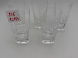 four shot glasses sitting on a table with a price tag on them