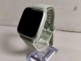 a apple watch sitting on a stand on a table