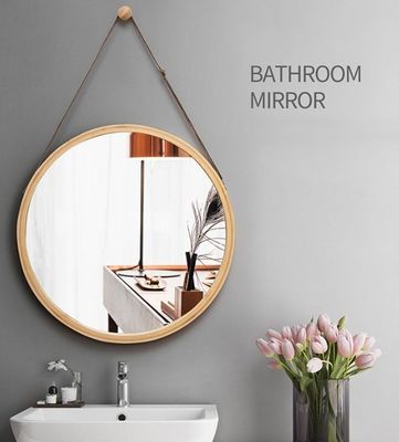 a bathroom mirror hanging on the wall next to a sink