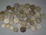a lot of coins that are on the table