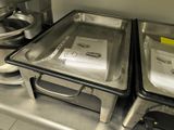 two pans that are sitting on a counter