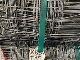 several rolls of wire are stacked on top of each other in a warehouse