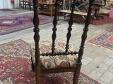 a chair that is sitting on a rug in a room