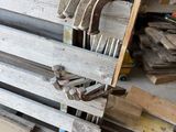 several pieces of wood are stacked on top of each other in a workshop