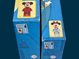 two boxes of legos that are sitting side by side