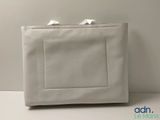 an image of a white purse sitting on top of a table