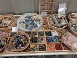 a table with a lot of different types of stones