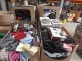 many boxes of clothing and other items in the store