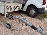 a truck with a trailer attached to it that has graffiti on the side of it