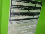 a picture of a machine that is green and has a label on it