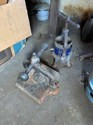an image of a garage with tools on the floor