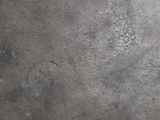 a close up of a metal surface with scratches on it