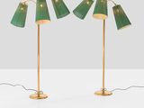 a pair of green lamps on a white surface