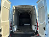 a white van with its doors open in a parking lot