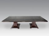 a black marble dining table with two wooden legs