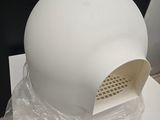a white hat that is sitting on top of a plastic bag