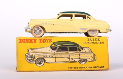 yellow toy car sitting on top of a yellow box on a white surface