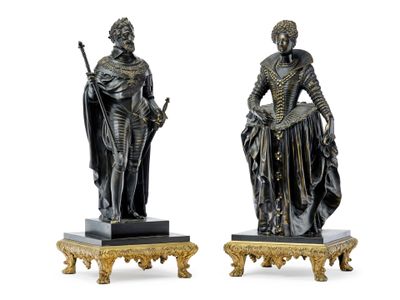 pair of bronze figurines of a woman and a man