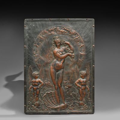 a bronze plaque depicting a woman and two children