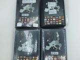 four passport covers with flags and a map of the world on them