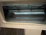 a small window in the inside of a small oven
