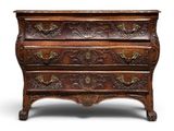 an old wooden chest of drawers with ornate carvings