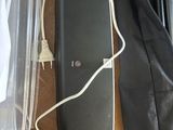 a black bag and a pair of headphones on a table