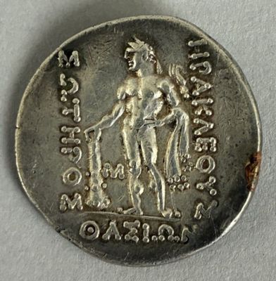 a close up of a silver coin with an image of a man on a horse