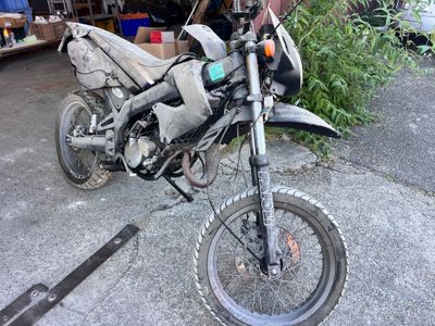 a motorcycle that is parked on the side of the road
