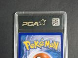 a close up of a pokemon card in a plastic case