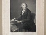 an old black and white photograph of a man sitting at a desk