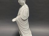 chinese white porcelain figure of a seated person on a rock