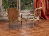 two chairs that are sitting in front of a window