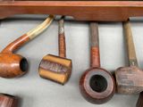 a lot of different types of pipes on the table