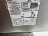 a close up of the back of a dishwasher with a label on it