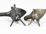 pair of bronze figurines of an elephant and an elephant ' s head